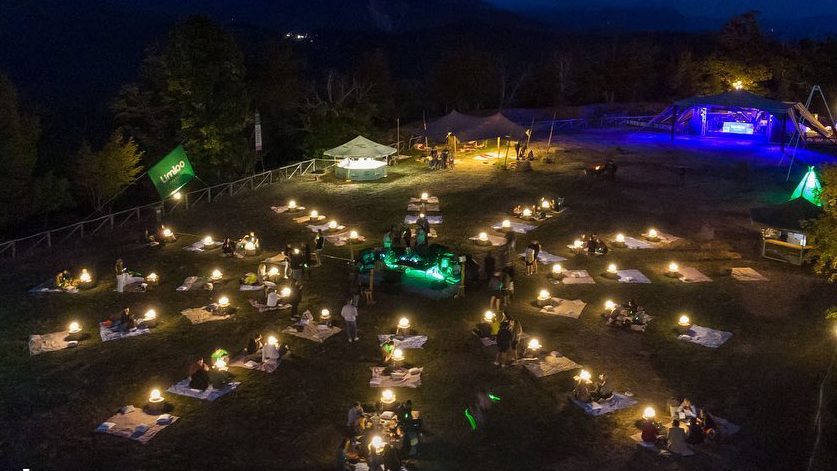 Night gathering with lights at Limbo Festival in the Tuscany, Italy