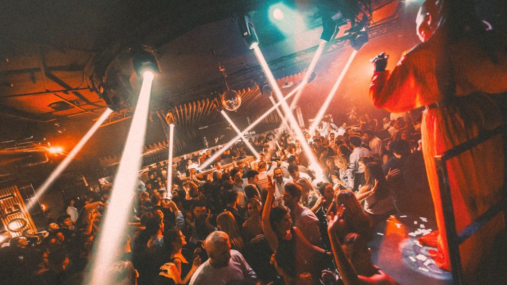 Party with lasers and crowd in the nightclub Sutton in Barcelona
