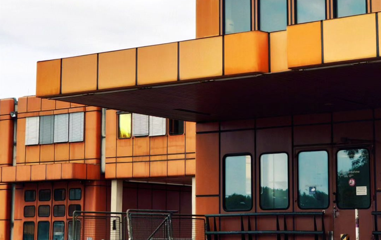 Orange building with many windows in Turbulence TXL in Berlin, Germany