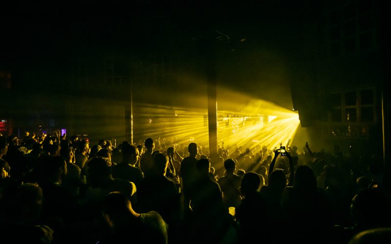 Crowd under yellow lights at ADE 2023