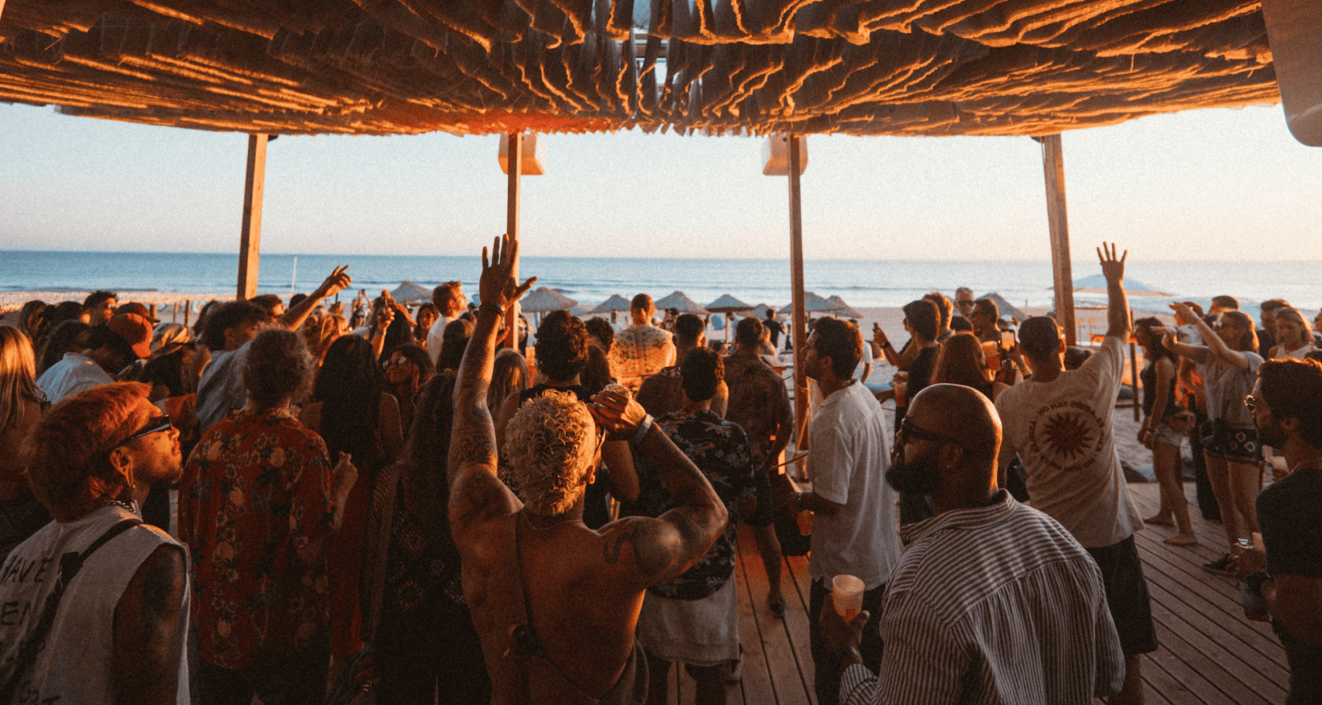 Festival-goers at MOGA Caparica 2025 beach party