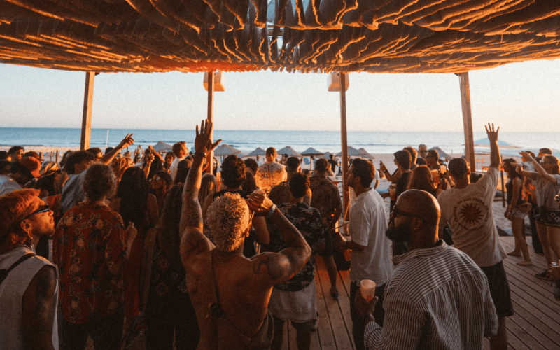 Festival-goers at MOGA Caparica 2025 beach party