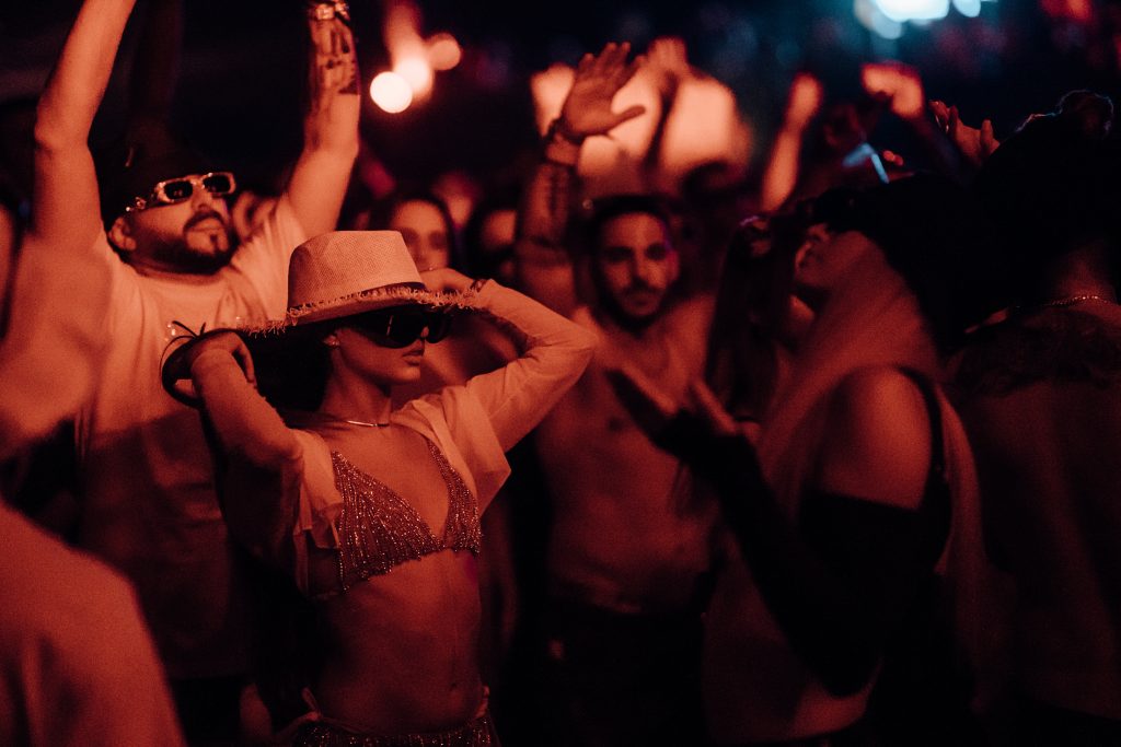 a candid picture of a party goer vibing at an electronic music festival in Europe