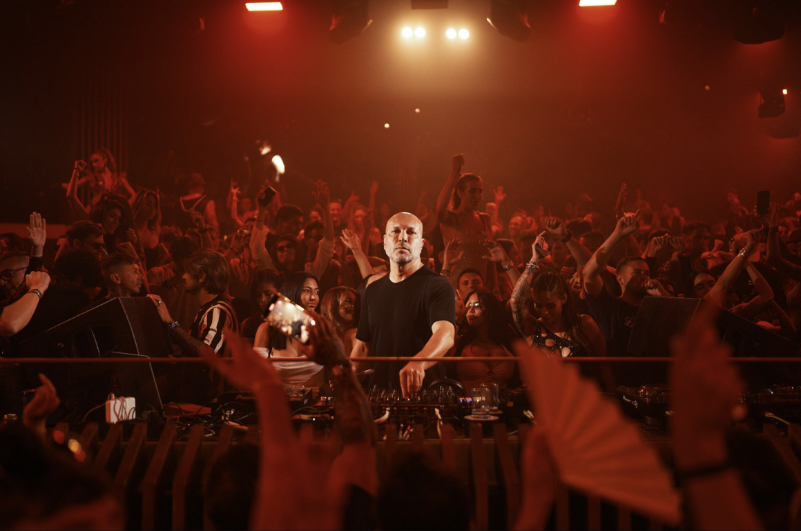 Marco Carola performing in front of a packed crowd