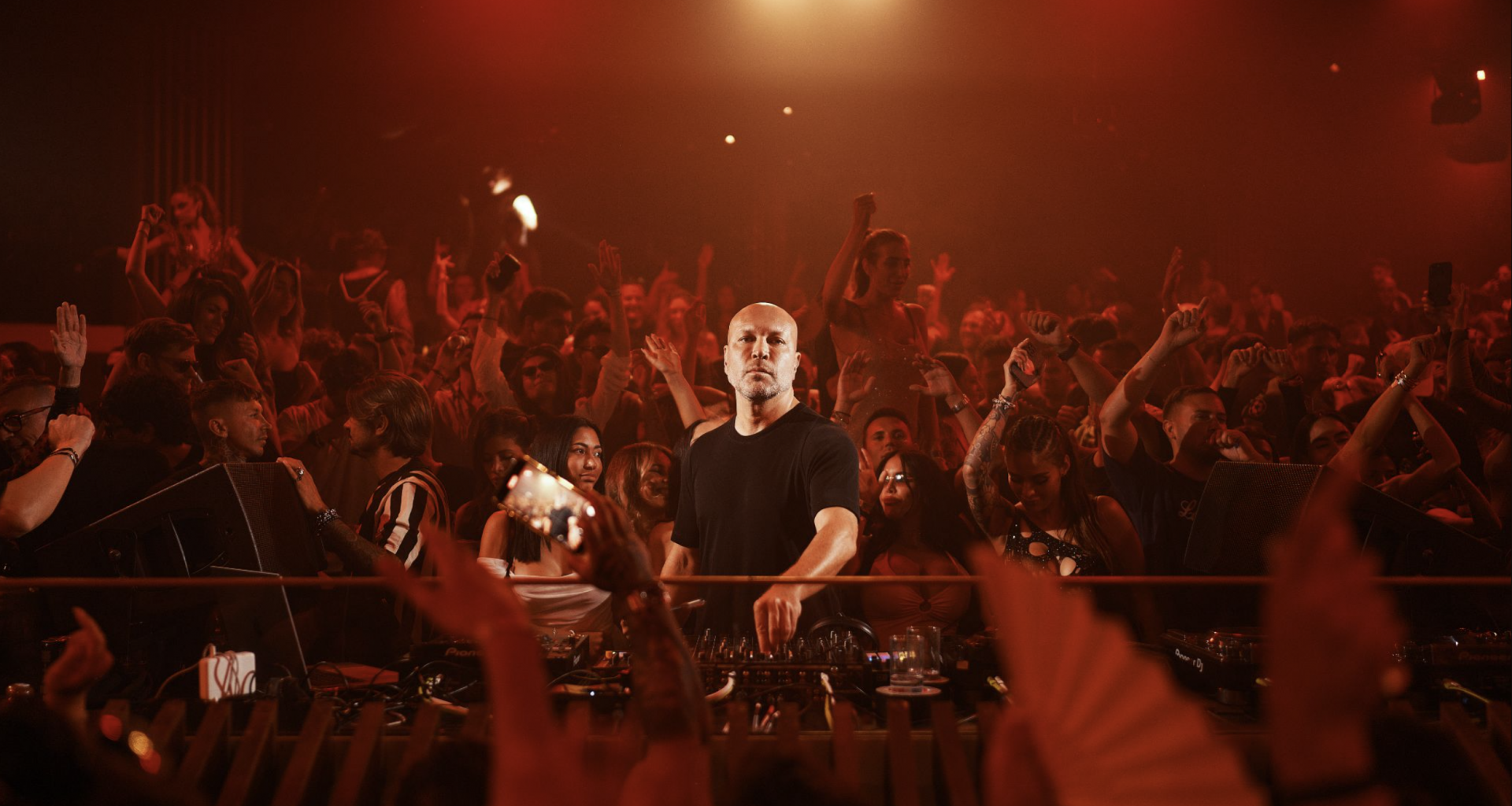 Marco Carola performing in front of a packed crowd