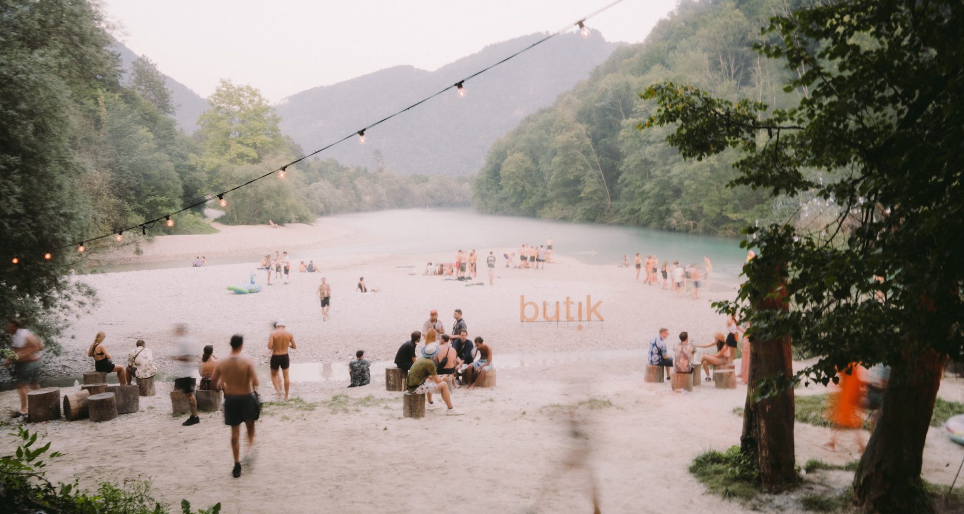 Festival crowd at Butik Festival Slovenia beside the Soča river in Tolmin Slovenia