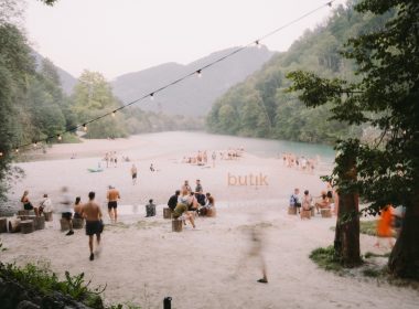 Festival crowd at Butik Festival Slovenia beside the Soča river in Tolmin Slovenia