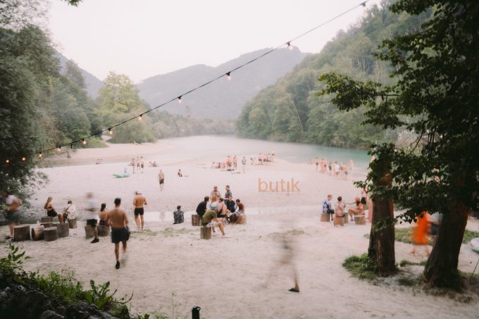 Festival crowd at Butik Festival Slovenia beside the Soča river in Tolmin Slovenia