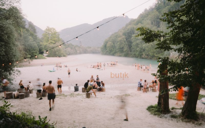 Festival crowd at Butik Festival Slovenia beside the Soča river in Tolmin Slovenia