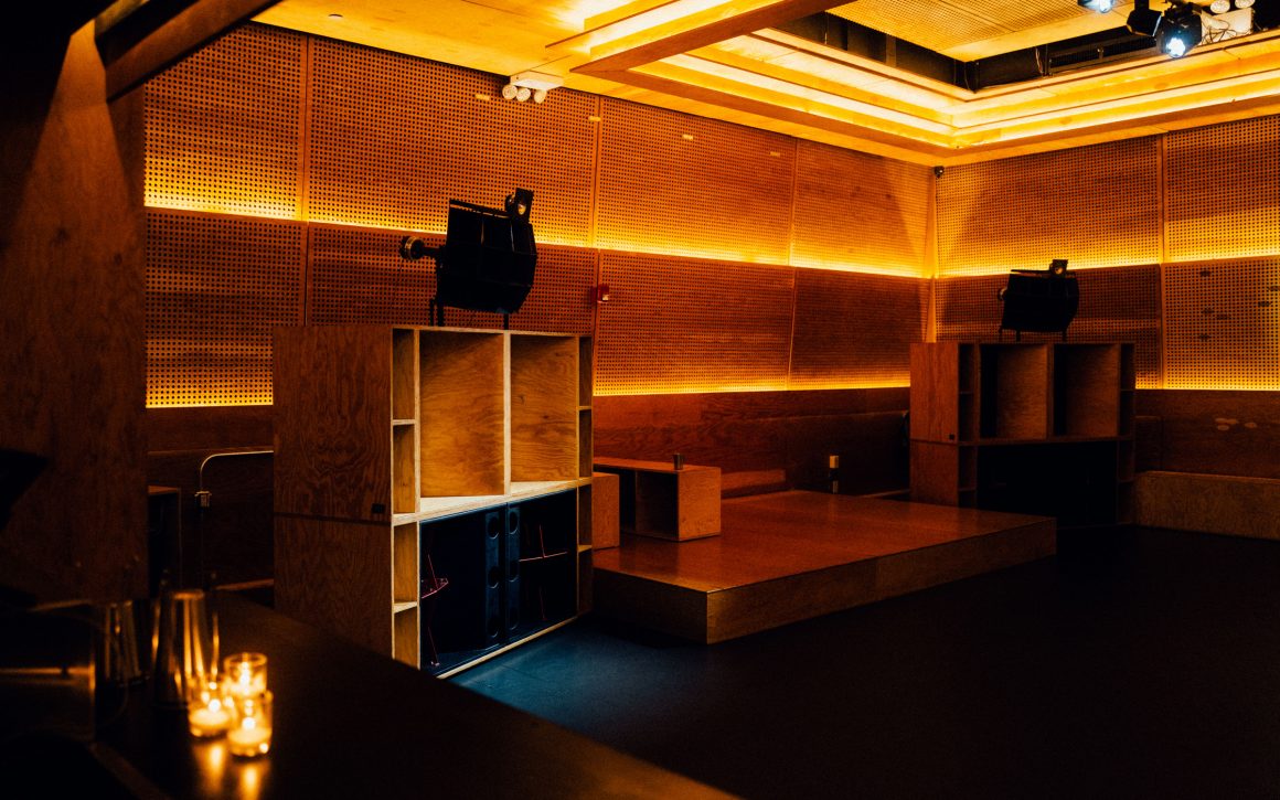 The Sound Room at Public Records Brooklyn, showcasing its hi-fi sound system and acoustic design in an empty, minimalist setting.