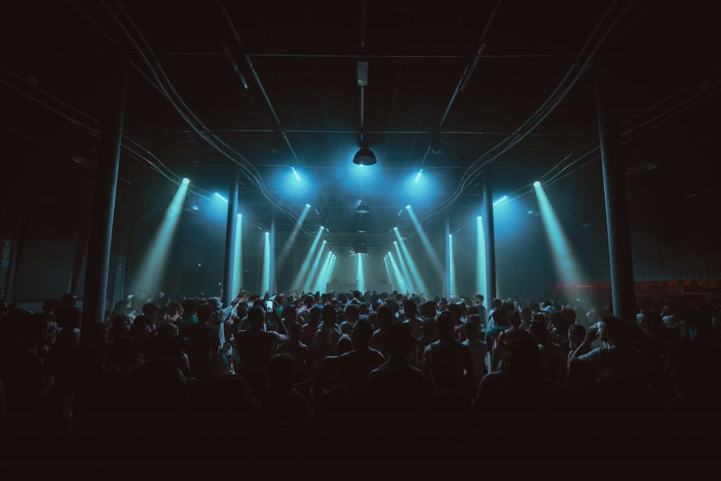 Panoramic view of the interior of Q35 Warehouse in Turin during a club night