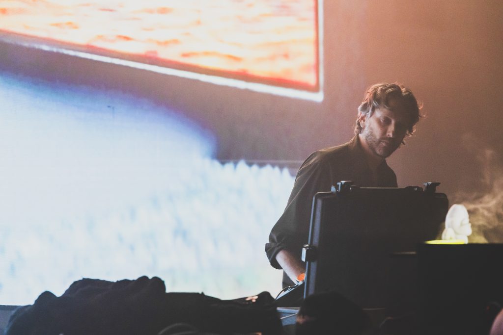 Oneohtrix Point Never on stage performing at Mira festival 2025