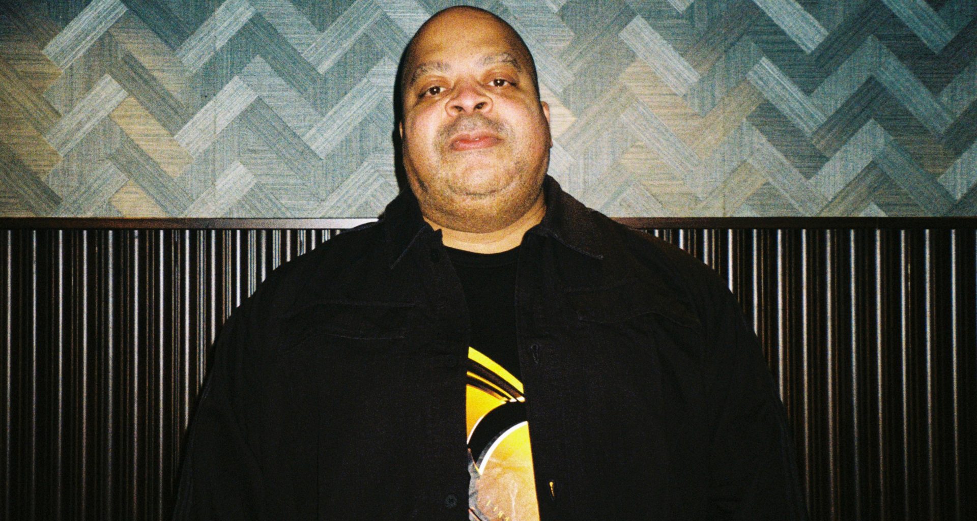 DJ Bone posing for an analog camera photography