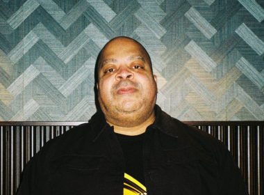 DJ Bone posing for an analog camera photography