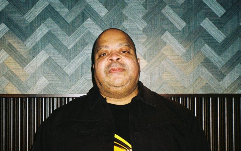 DJ Bone posing for an analog camera photography