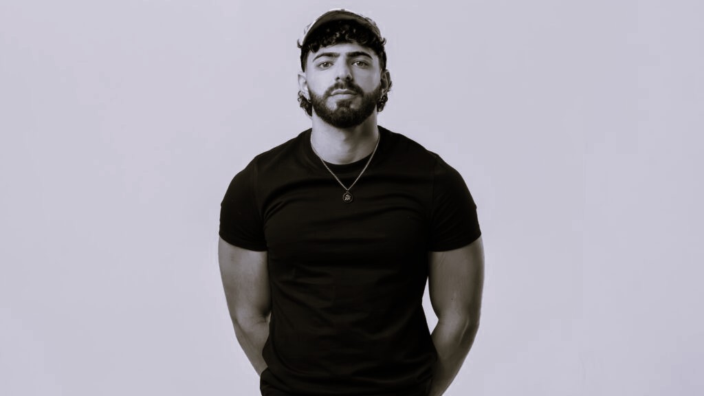 A black and white image of the DJ Restricted in front of a white background.