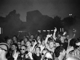 Electronic music open air party crowd on analog film at nighttime