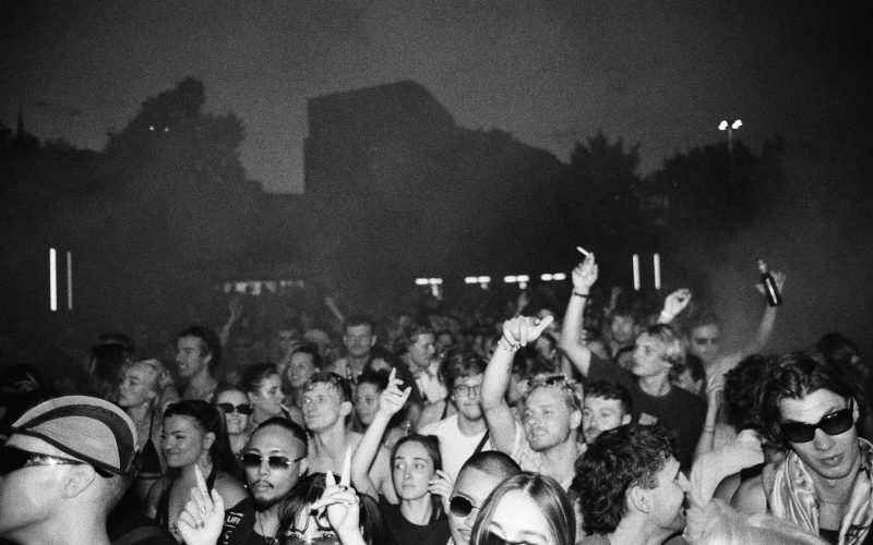 Electronic music open air party crowd on analog film at nighttime